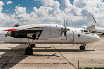 Exterior of AN-26 cargo aircraft parked at the airport