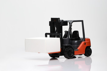 A forklift truck, detail view, forklift in white background