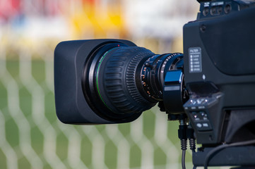 Fototapeta na wymiar TV camera + broadcasting during a football (soccer) match