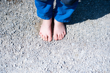 Barefoot lifestyle. Child without shoes.
