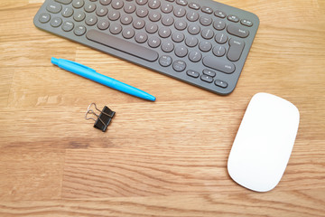 keyboard on a wooden table, work from home during a pandemic, computer mouse and pen