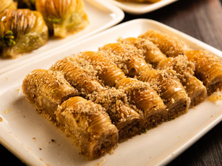 Different kinds of Turkish dessert baklava on the table.