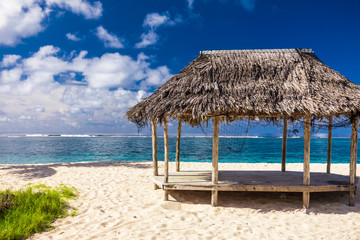 Lalomanu beach with open huts called fales, south side of Upolu Island, Samoa