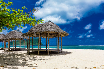 Lalomanu beach with open huts called fales, south side of Upolu Island, Samoa