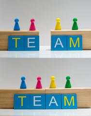 Four pawn figurines, team concept