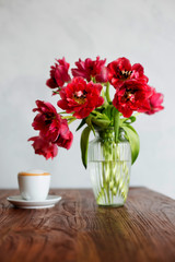 Beautiful tulips bouquet on wooden table