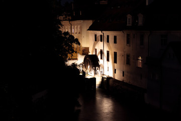 Fototapeta na wymiar The Grand Priory Mill in the Devil's Channel, Vltava River, Prague lit at night.