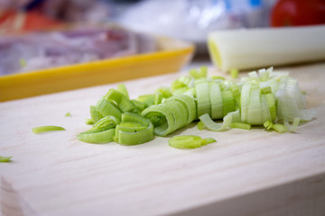 Sliced leek on a wooden cutting board