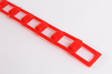 red plastic chain on a white background