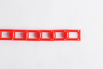 red plastic chain on a white background