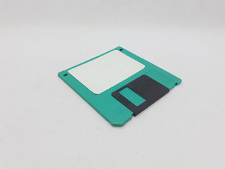 Vintage Photo Realistic Small Electronic Magnetic Floppy Disk for Old Computer Data Storage in White Isolated Background