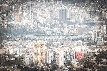 Panoramic view to Dinamo arena stadium and Tbilisi from aerial perspective. Nighborhoods and sports in Sakartvelo. Georgia.2020