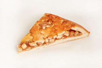 Pie stuffed with apples. Fresh pastries. Closeup on a light background