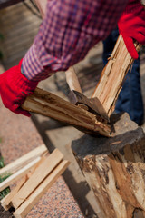 Close-up of  man tearing  chopped log