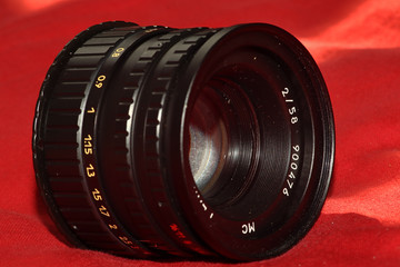 A 90's version of a vintage Helios 44-3 lens with an adapter for a modern camera system
