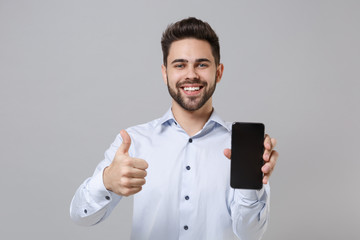 Smiling unshaven business man in light shirt isolated on grey background. Achievement career wealth...