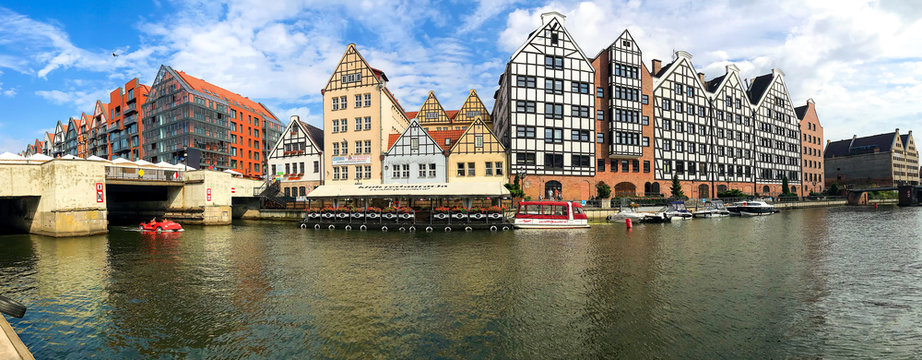 Gdansk, Poland - 21/ 06/ 2019:. Beautiful multi-colored houses in the old town in Gdansk. The central streets of the historic center of Gdansk. The main tourist attraction of Gdansk. 
Panoramic photo.