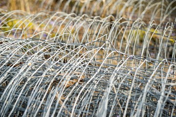 Wire Mesh Fence in Roll Background.