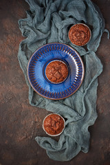 Chocolate muffins for dessert, flat lay