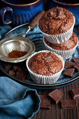 Chocolate muffins with crispy top,  selective focus
