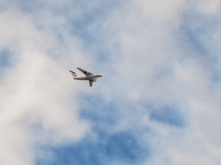 Fototapeta na wymiar A heavy transport plane is flying in the sky