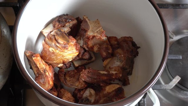 closeup of several freshly fried pieces of pork and meat