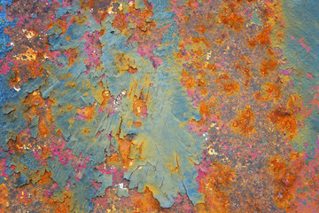 Rusted metal grunge textured background with old vintage corroded and weathered peeling paint texture, grungy cracked blue paint with orange rust spots on pink painted antique wall