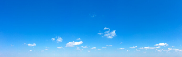 Naklejka na ściany i meble Blue sky background. Natural background. Panorama sky with tiny clouds