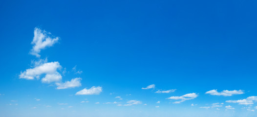 Blue sky background. Natural background. Panorama sky with tiny clouds