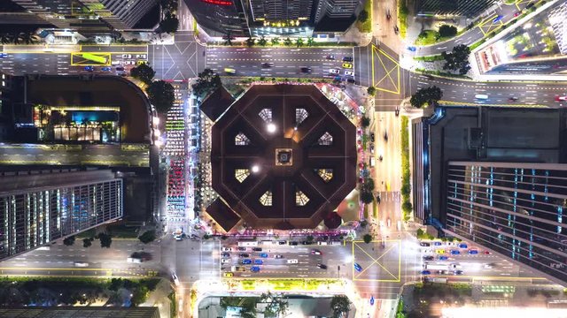 4K time-lapse of car traffic transport at square junction road intersection in Singapore city downtown district, drone aerial top view. Transportation technology, Asian city life, Asia travel concept