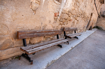 Brown wooden benches on the street