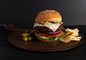 Homemade burger on a dark background