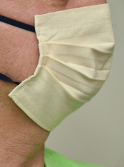 protective mask ,Homemade  face Mask -Coronavirus COVID-19),protection mask fixed on the face,cream-colored