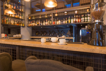 Empty wooden bar counter with tea set, bar or cafeteria