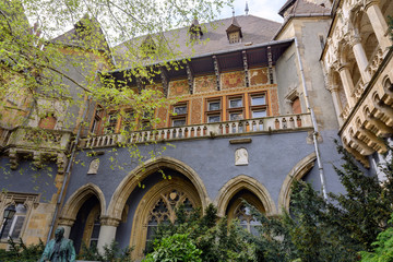 Fototapeta na wymiar Vajdahunyad Castle in Budapest. The castle is a decoration of Varoshliget park. Vaidahunyad Castle houses the Agricultural Museum.
