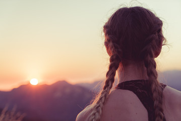 woman looking at sunset