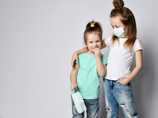 Two children are afraid of the disease virus wear protection masks from the Coronavirus Covid-19 afraid madness 