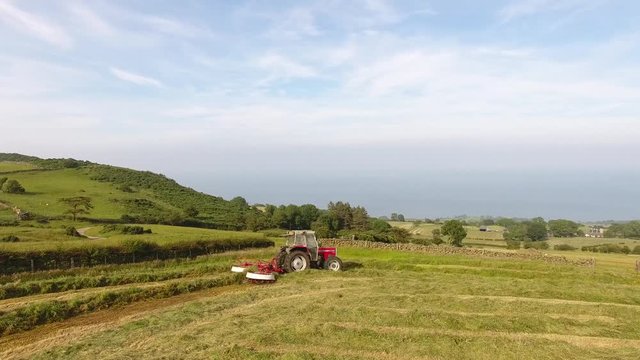 Massey Ferguson 390T rowing grass for silage 