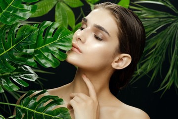 beautiful woman naked shoulders cosmetics green leaves luxury model