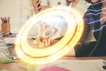 Double exposure of woman hands typing on computer and crypto market theme hologram drawing. Blockchain concept.