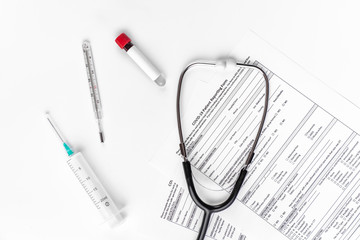 Laboratory test form for the result of coronavirus. A syringe, thermometer, stethoscope and test tube for analysis on covid-19 in a medical office Outbreak of a new disease from China, Wuhan.