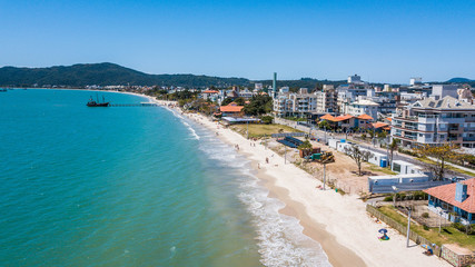 Fototapeta na wymiar Aerial view of Canasvieiras beach (praia Canasvieiras), in Florianópolis, state of Santa catarina, Brazil