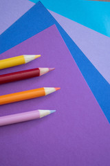 Colored pencils on colored paper