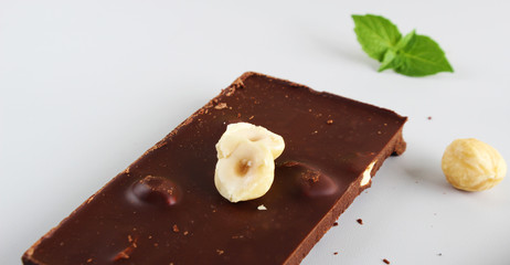 chocolate bar with hazelnut on a light background
