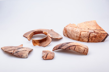 Archaeological excavations. The remains of ancient ancient clay jugs. Tripolie.