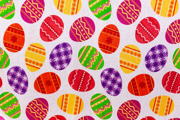 Easter themed tablecloth with colored eggs pattern. Background, texture