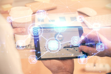 Double exposure of man's hands holding and using a phone and social network theme drawing.