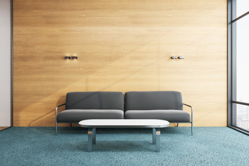 Minimalistic waiting room with sofa and blank wooden wall. - obrazy, fototapety, plakaty