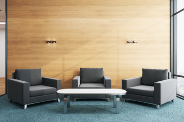 Modern waiting room with chairs and blank wooden wall.