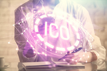 Obraz premium Double exposure of blockchain business sketch hologram and woman holding and using a mobile device.